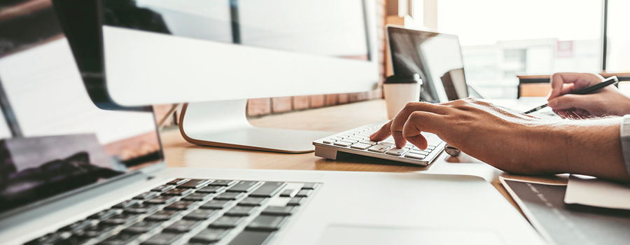 Person Typing On A Computer Keyboard